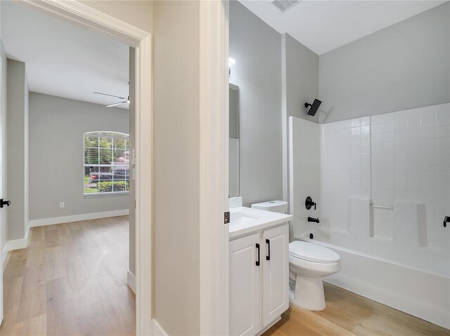 2823 NE 24th Pl, Ocala, FL 34470 - bathroom with wood finished floors, vanity, shower / bathtub combination, and a ceiling fan
