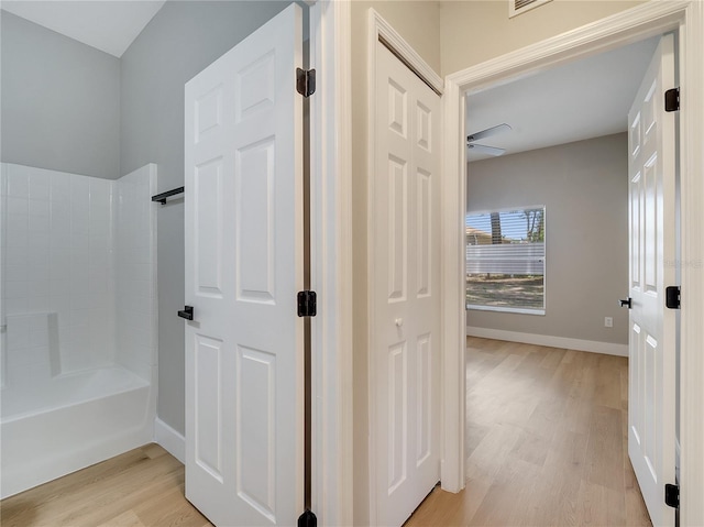 2823 NE 24th Pl, Ocala, FL 34470 - full bath featuring wood finished floors and shower / tub combination