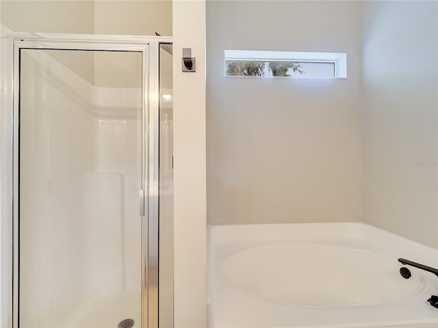 2823 NE 24th Pl, Ocala, FL 34470 - bathroom featuring a stall shower and a garden tub