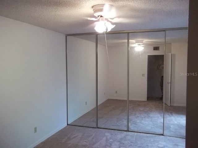 5327 Bamboo Ct Unit 426, Orlando, FL 32811 - unfurnished bedroom with a textured ceiling and a closet