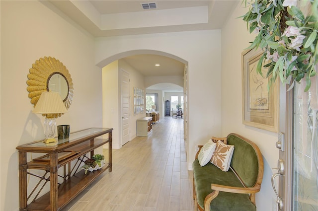 1774 Pasture Loop, Oviedo, FL 32765 - hallway featuring arched walkways, light wood finished floors, and a raised ceiling