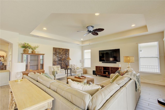 1774 Pasture Loop, Oviedo, FL 32765 - living room with ceiling fan, a raised ceiling, light wood-type flooring, arched walkways, and recessed lighting