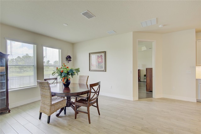 1774 Pasture Loop, Oviedo, FL 32765 - dining space featuring light wood-style flooring and a textured ceiling