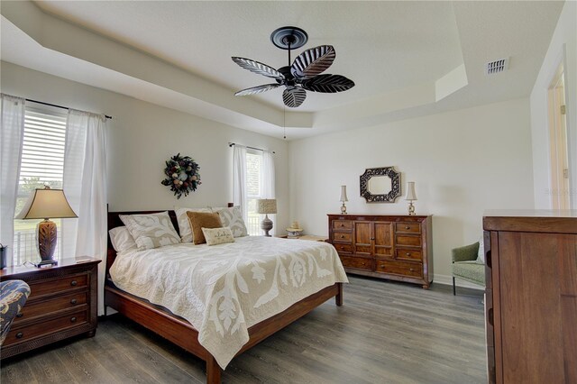 1774 Pasture Loop, Oviedo, FL 32765 - bedroom featuring a raised ceiling, dark wood-type flooring, and ceiling fan