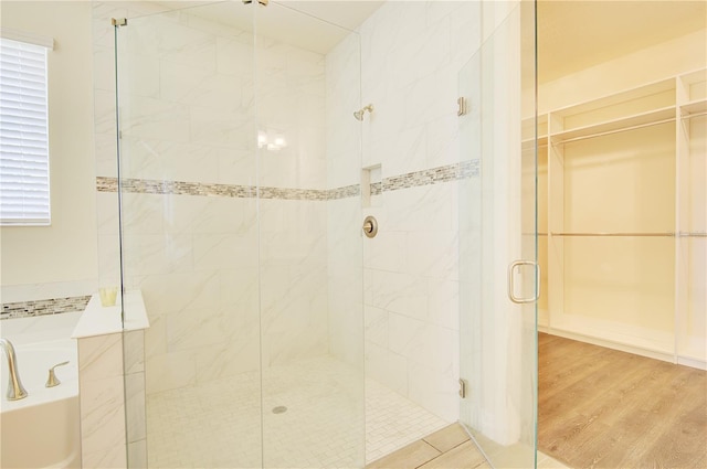 1774 Pasture Loop, Oviedo, FL 32765 - bathroom featuring a shower stall, a garden tub, and wood finished floors