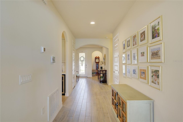 1774 Pasture Loop, Oviedo, FL 32765 - hall featuring arched walkways, light wood-type flooring, and recessed lighting