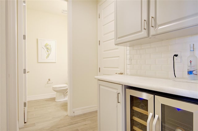 1774 Pasture Loop, Oviedo, FL 32765 - indoor dry bar with beverage cooler, decorative backsplash, and light wood-style flooring