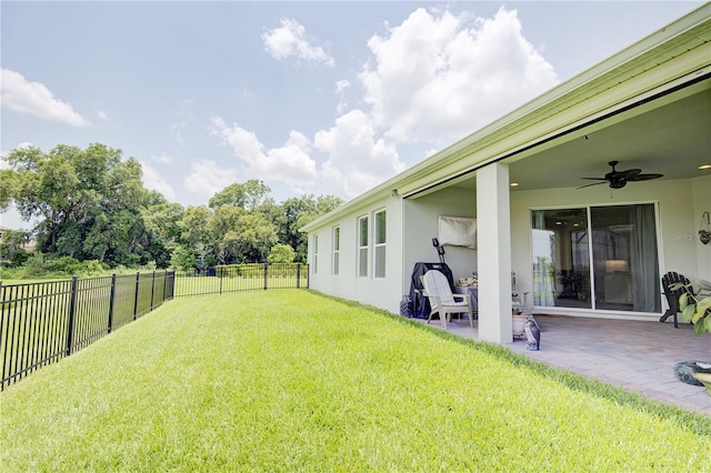 1774 Pasture Loop, Oviedo, FL 32765 - fenced backyard with ceiling fan and a patio area