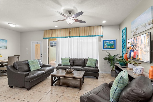 1909 Majorca Dr, Kissimmee, FL 34747 - living area with light tile patterned floors, a ceiling fan, recessed lighting, and a textured ceiling
