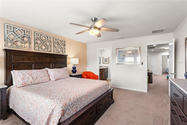 1909 Majorca Dr, Kissimmee, FL 34747 - bedroom featuring light carpet, a ceiling fan, and ensuite bathroom