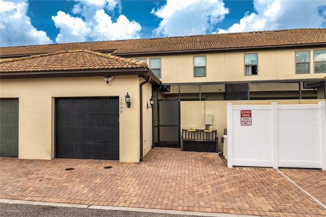 1909 Majorca Dr, Kissimmee, FL 34747 - view of front facade with stucco siding and a tile roof