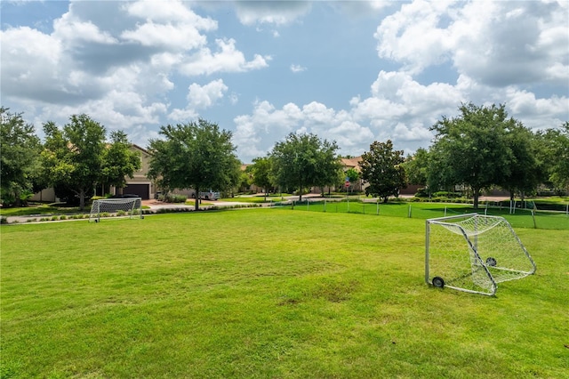 1909 Majorca Dr, Kissimmee, FL 34747 - view of home's community with an area for soccer and an attached garage