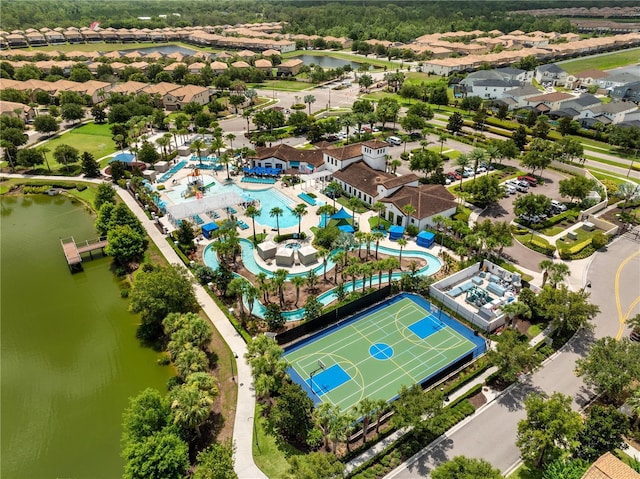 1909 Majorca Dr, Kissimmee, FL 34747 - aerial perspective of suburban area featuring a pool area and a nearby body of water