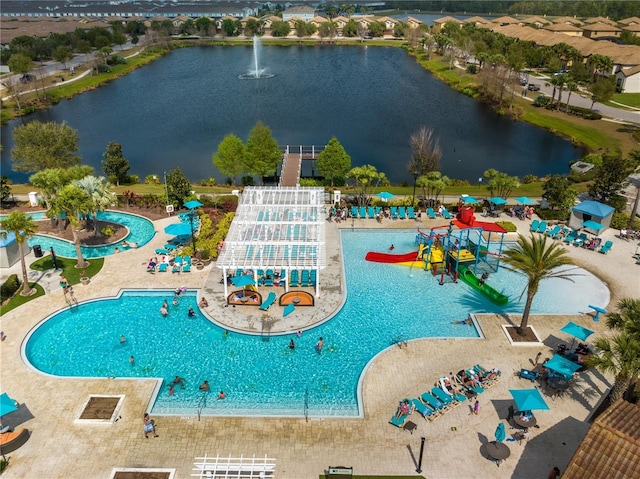 1909 Majorca Dr, Kissimmee, FL 34747 - view of swimming pool featuring a water view and a water slide