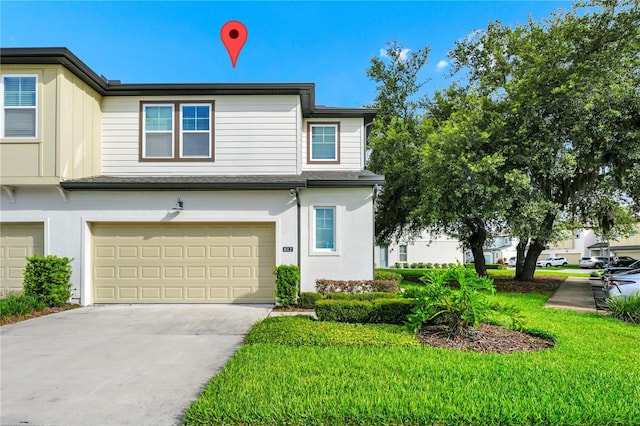 812 Benoi Dr, Davenport, FL 33896 - townhome / multi-family property featuring a garage, driveway, and stucco siding