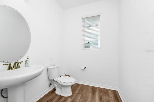 812 Benoi Dr, Davenport, FL 33896 - half bathroom featuring toilet and wood finished floors