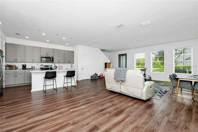 812 Benoi Dr, Davenport, FL 33896 - living area featuring wood finished floors and recessed lighting