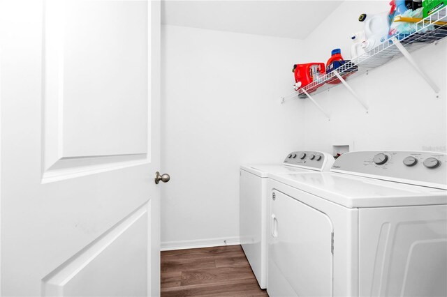 812 Benoi Dr, Davenport, FL 33896 - washroom featuring independent washer and dryer and wood finished floors
