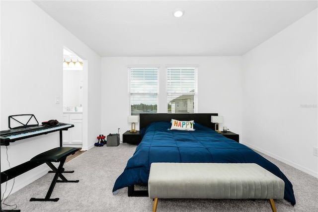 812 Benoi Dr, Davenport, FL 33896 - carpeted bedroom featuring baseboards and connected bathroom