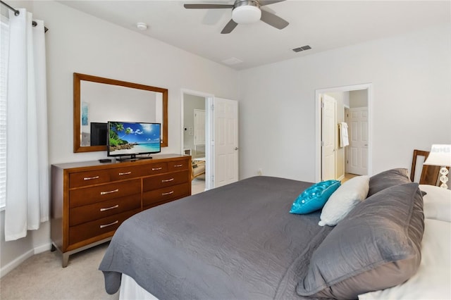 2616 Bowring St, Kissimmee, FL 34747 - bedroom with light carpet, a ceiling fan, and ensuite bathroom