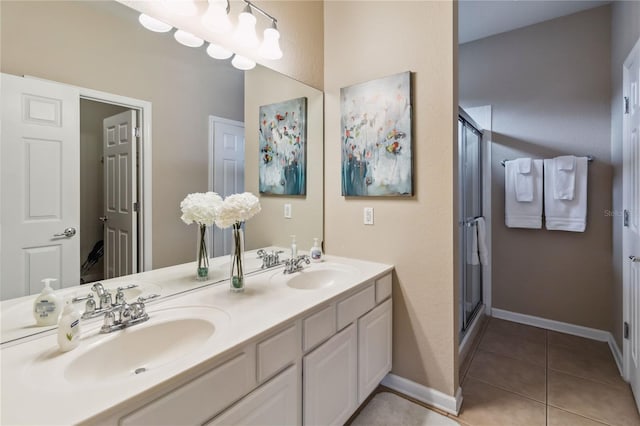 2616 Bowring St, Kissimmee, FL 34747 - bathroom with double vanity, a shower stall, and tile patterned floors