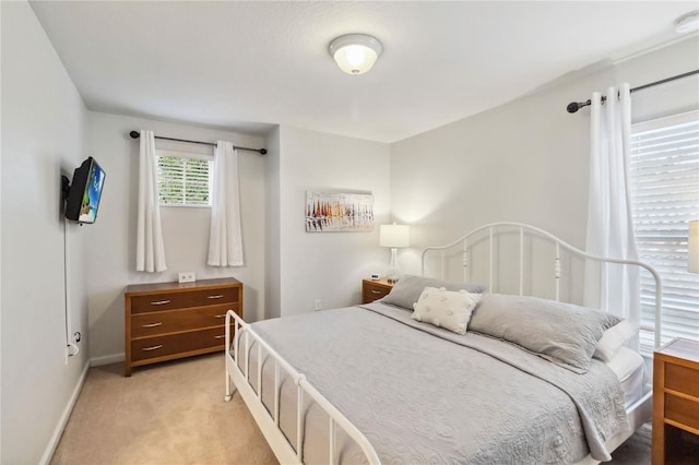 2616 Bowring St, Kissimmee, FL 34747 - bedroom featuring light carpet and baseboards