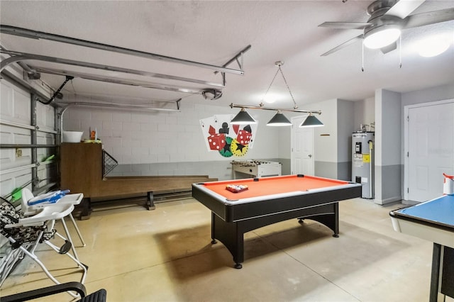 2616 Bowring St, Kissimmee, FL 34747 - game room with electric water heater, billiards table, concrete flooring, and concrete block wall