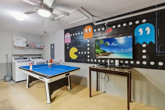2616 Bowring St, Kissimmee, FL 34747 - playroom featuring washer / dryer, concrete flooring, electric panel, a textured ceiling, and concrete block wall