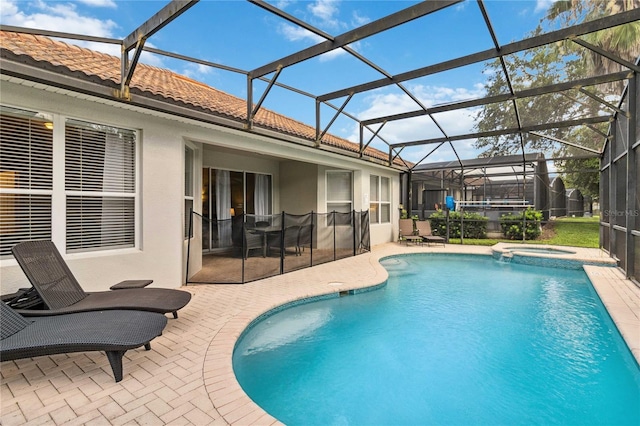 2616 Bowring St, Kissimmee, FL 34747 - view of swimming pool with a patio, a pool with connected hot tub, and a lanai