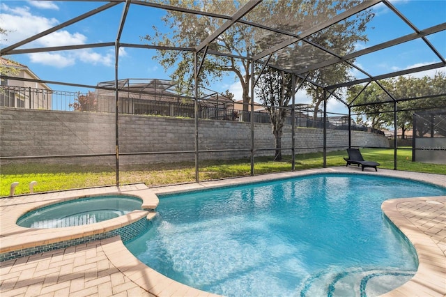 2616 Bowring St, Kissimmee, FL 34747 - view of pool featuring a pool with connected hot tub, glass enclosure, and a lawn