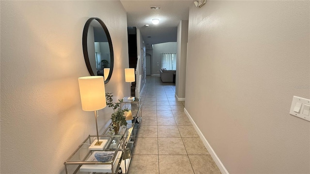8940 Sugar Palm Rd, Kissimmee, FL 34747 - corridor featuring light tile patterned floors and baseboards
