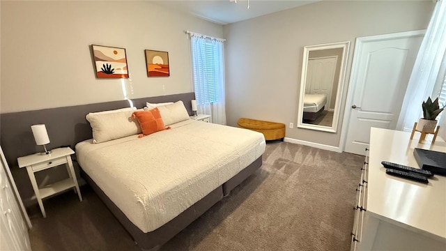 8940 Sugar Palm Rd, Kissimmee, FL 34747 - bedroom featuring dark colored carpet and baseboards