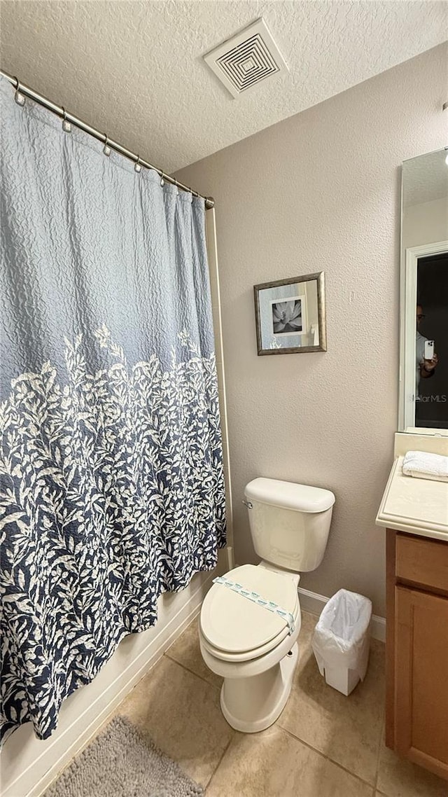 8940 Sugar Palm Rd, Kissimmee, FL 34747 - bathroom with vanity, tile patterned flooring, a textured ceiling, and curtained shower