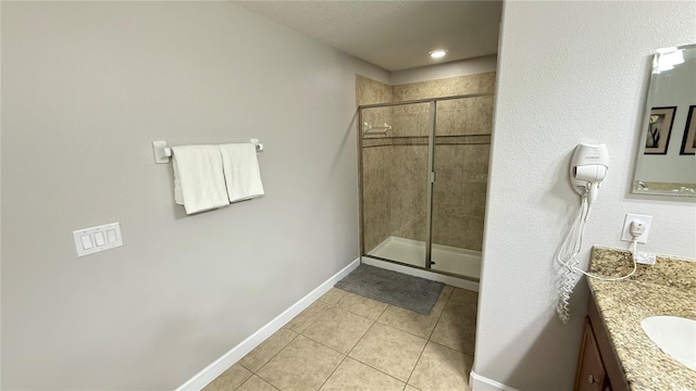 8940 Sugar Palm Rd, Kissimmee, FL 34747 - bathroom featuring vanity, tile patterned flooring, and a shower stall
