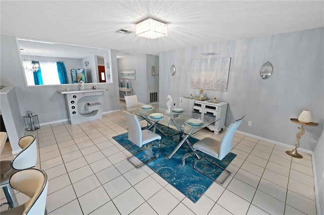 543 Silver Crse, Ocala, FL 34472 - tiled dining room featuring a textured ceiling and a chandelier