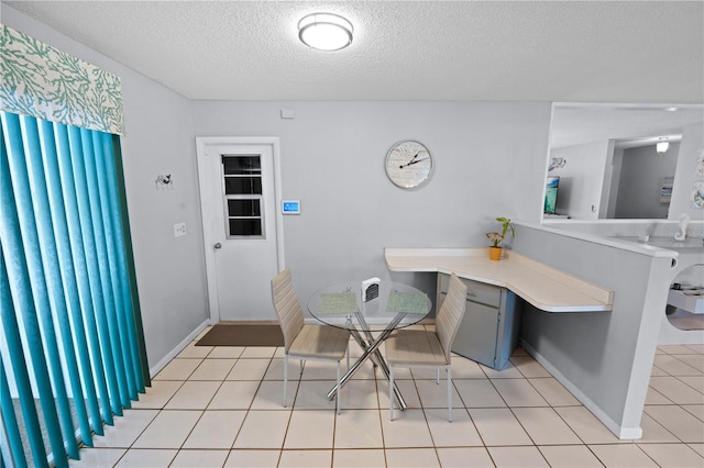 543 Silver Crse, Ocala, FL 34472 - dining room featuring a textured ceiling and light tile patterned flooring