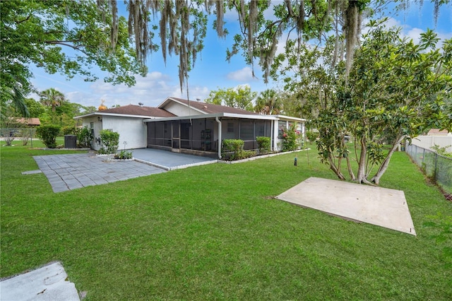 543 Silver Crse, Ocala, FL 34472 - fenced backyard featuring a patio and a sunroom