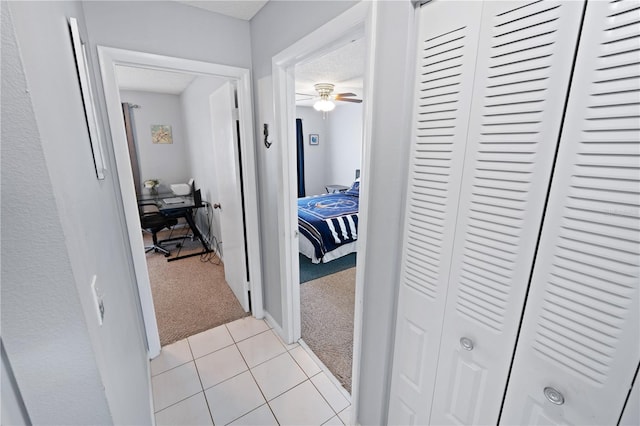 543 Silver Crse, Ocala, FL 34472 - corridor featuring light colored carpet, a desk, and light tile patterned floors