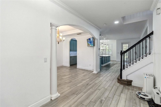 530 Harriswood Ct, Davenport, FL 33837 - foyer featuring a chandelier, arched walkways, light wood-style flooring, ornamental molding, and recessed lighting
