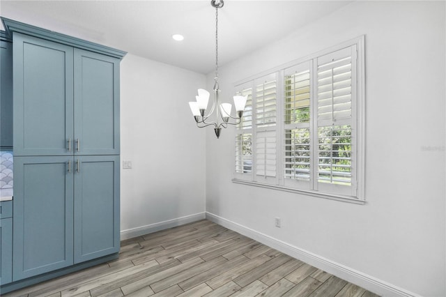 530 Harriswood Ct, Davenport, FL 33837 - unfurnished dining area with a chandelier, light wood finished floors, and recessed lighting