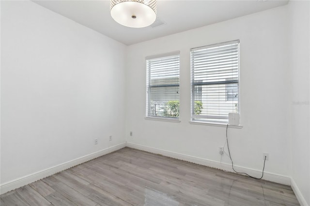 530 Harriswood Ct, Davenport, FL 33837 - empty room with light wood-type flooring and baseboards