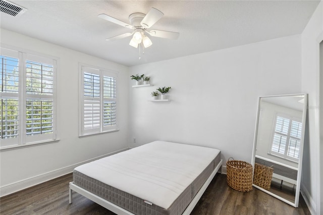 530 Harriswood Ct, Davenport, FL 33837 - bedroom with wood finished floors and a ceiling fan