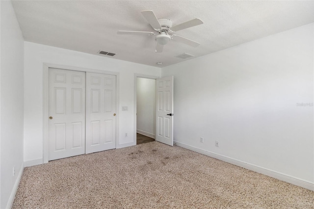 530 Harriswood Ct, Davenport, FL 33837 - unfurnished bedroom with carpet floors, a closet, and a ceiling fan