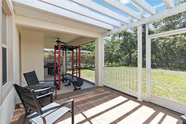 530 Harriswood Ct, Davenport, FL 33837 - sunroom with a ceiling fan and view of wooded area