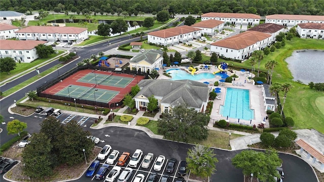 530 Harriswood Ct, Davenport, FL 33837 - aerial view of property's location featuring a pool and a large body of water