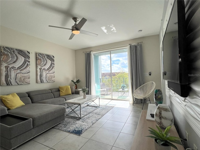 4751 Clock Tower Dr Unit 304, Kissimmee, FL 34746 - living room featuring light tile patterned flooring and ceiling fan