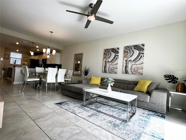 4751 Clock Tower Dr Unit 304, Kissimmee, FL 34746 - living area featuring a chandelier, a ceiling fan, and light tile patterned floors