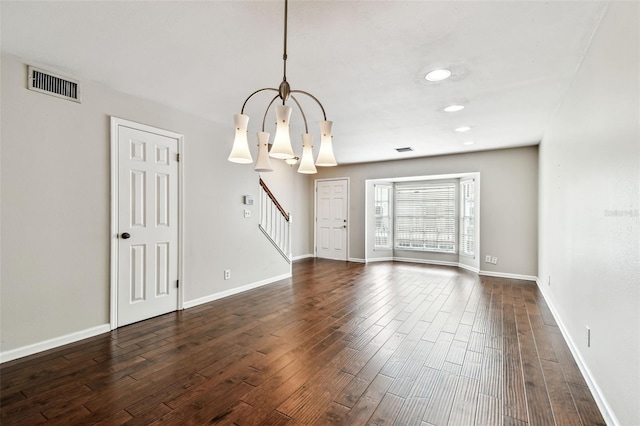 609 S Glen Ave Unit E, Tampa, FL 33609 - empty room with a chandelier, stairs, dark wood finished floors, and recessed lighting