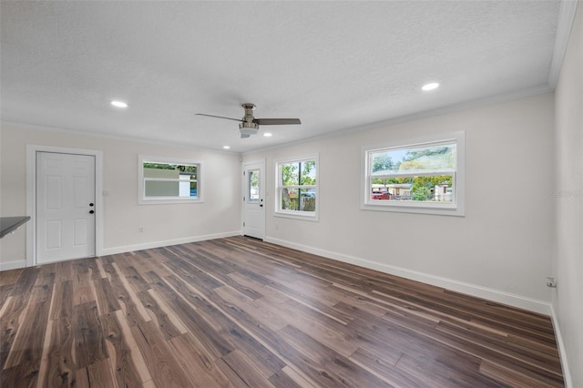 709 Suzette Dr, Ocoee, FL 34761 - empty room with crown molding, ceiling fan, dark wood finished floors, recessed lighting, and a textured ceiling