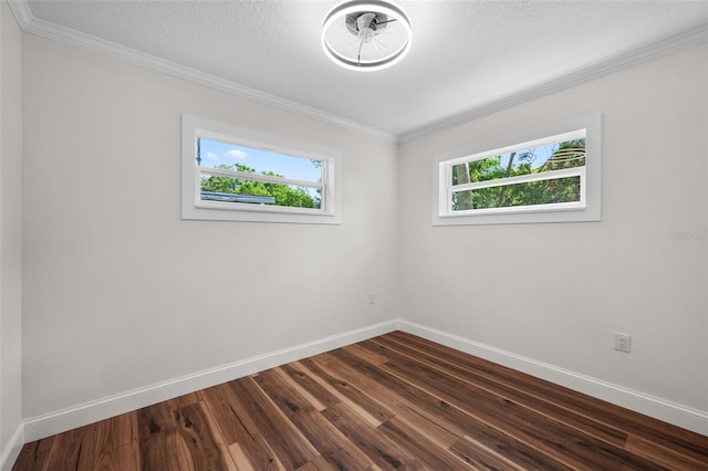 709 Suzette Dr, Ocoee, FL 34761 - unfurnished room with crown molding and dark wood-type flooring